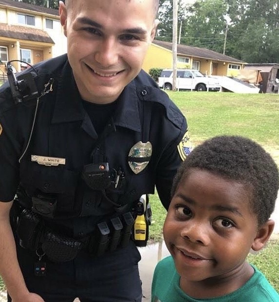 A child dials 911 seeking assistance from police officer. - Avokaddo.com