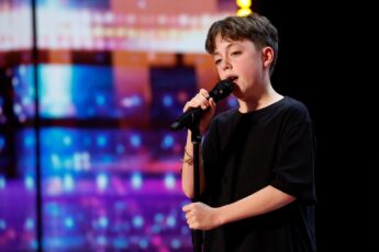 Alfie Andrew singing on stage