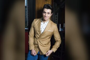 Dean John Wilson in a gold jacket