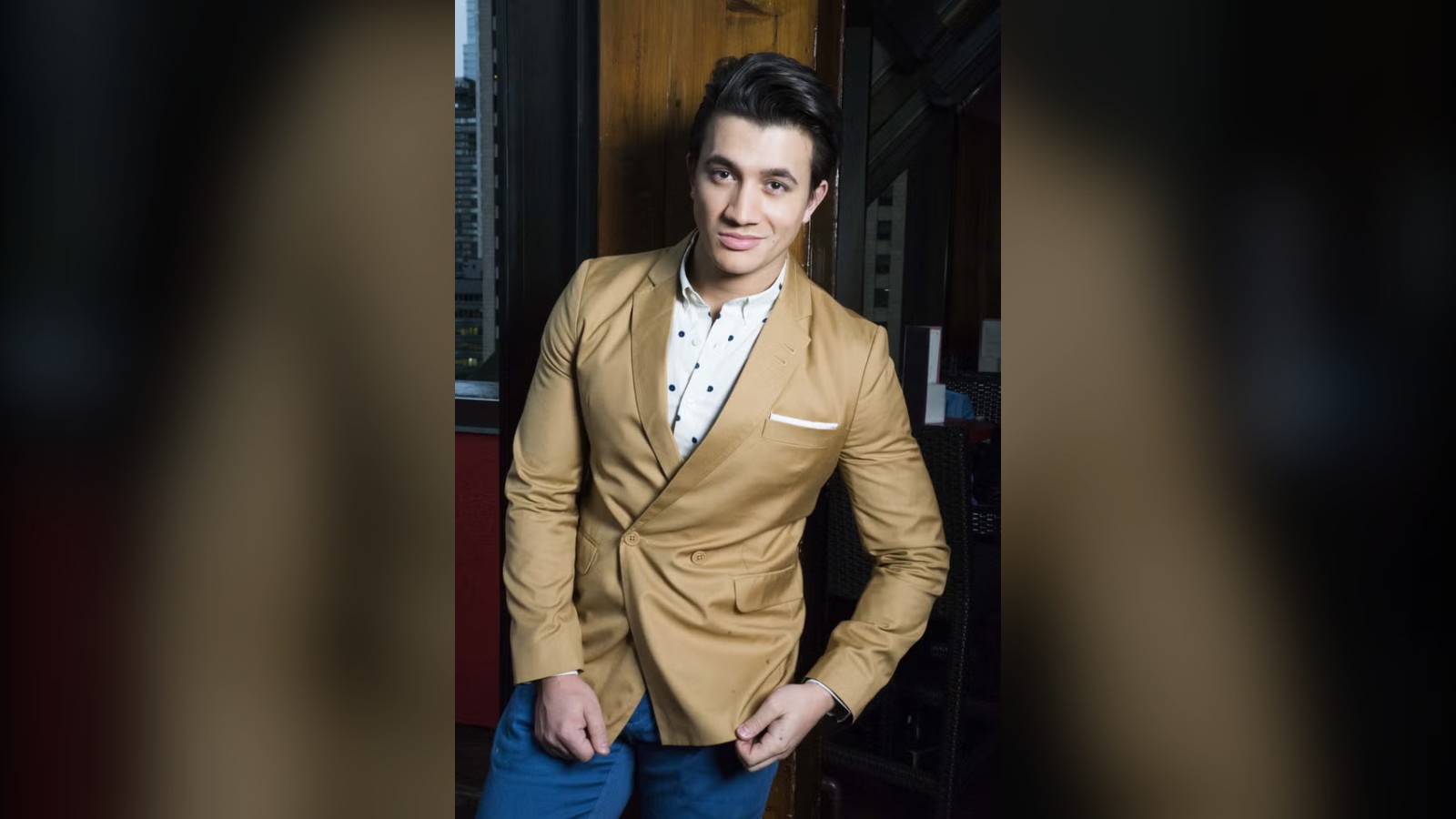 Dean John Wilson in a gold jacket