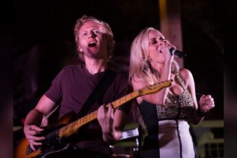 Makenna and Brock singing live together with a guitar