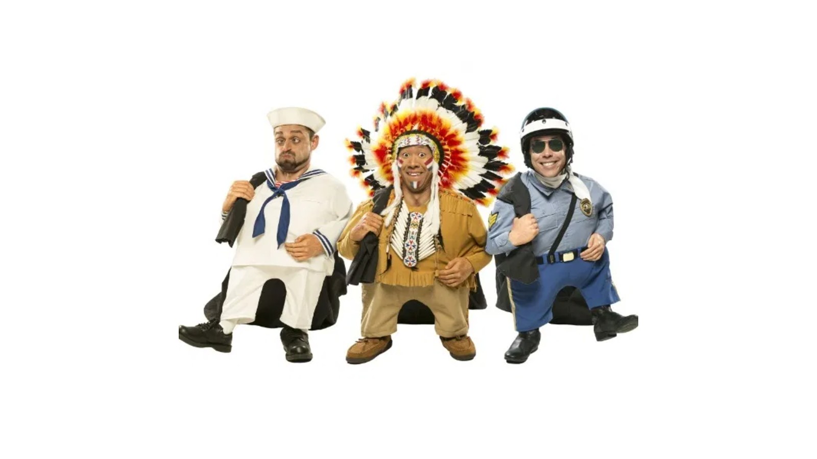 The Quiddlers comedy group as tiny people in sailor, chief and police costumes