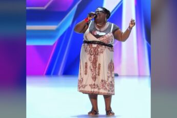 Panda Ross singing on stage