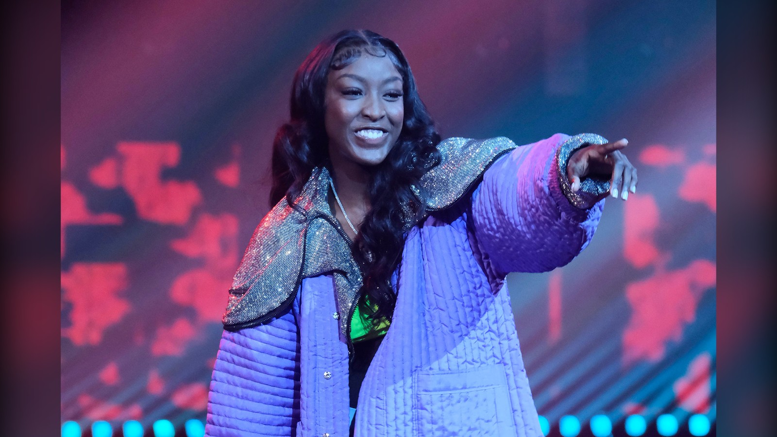 Flau'jae performing on stage